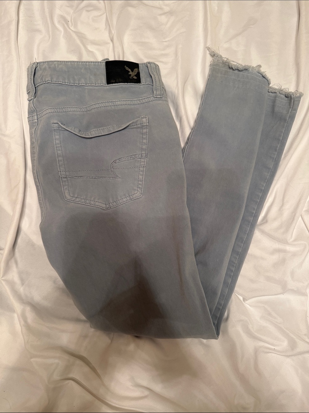 American Eagle Outfitters Light Wash Skinny Jeans with Frayed Hem